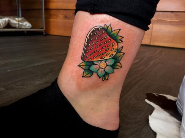 15 lovely strawberry tattoos and their meanings