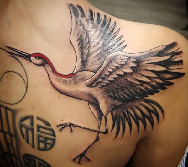 19 stunning crane tattoos and their meanings