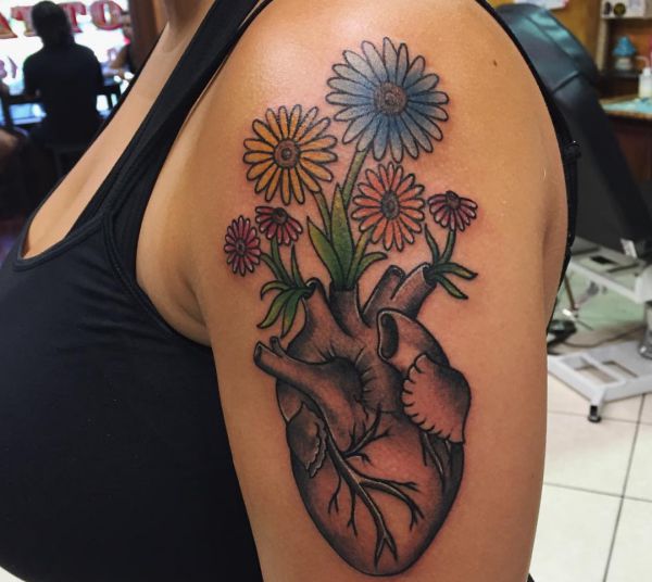 33 stunning daisy tattoos and their meanings