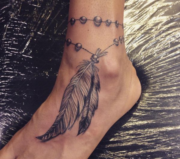 19 mysterious Native American feather tattoos and meanings