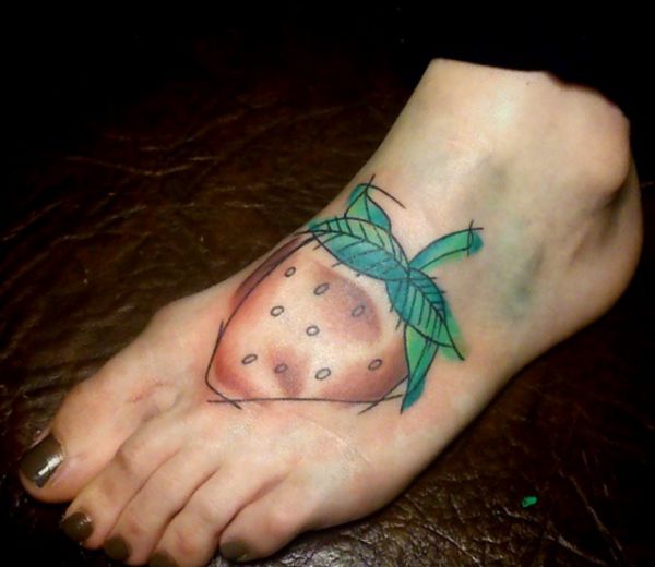 15 lovely strawberry tattoos and their meanings