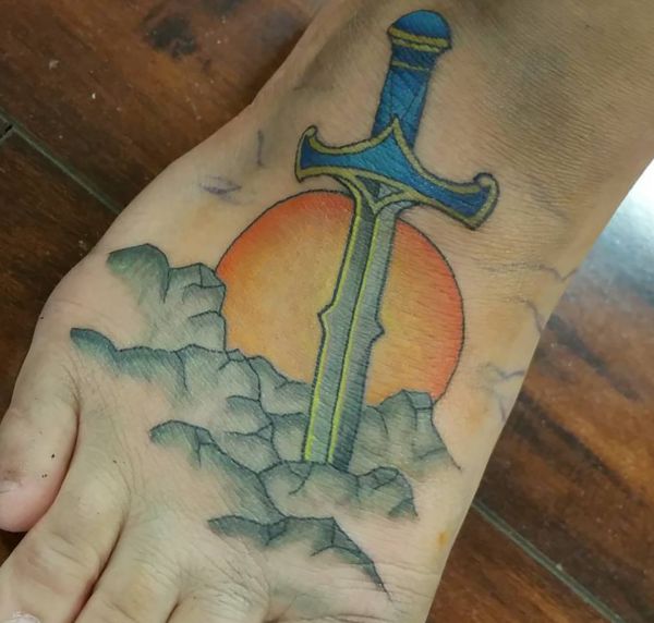 20 sword tattoo motifs and their symbolic which means