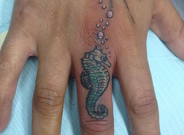 21 seahorse tattoos - as a tattoo the animal stands for endurance