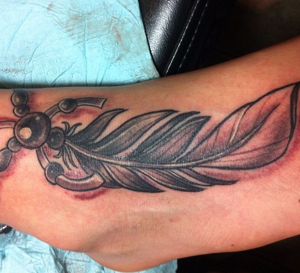 19 mysterious Native American feather tattoos and meanings