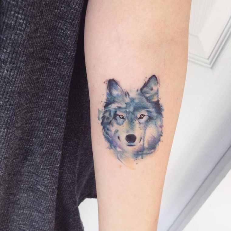 Wolf tattoo and wolf's head - fashions and which means in photos