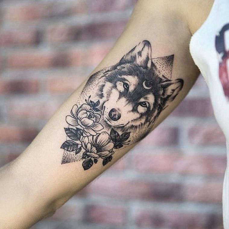 Wolf tattoo and wolf's head - fashions and which means in photos