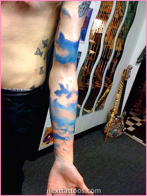 Men's Cloud Tattoos On Upper Arm