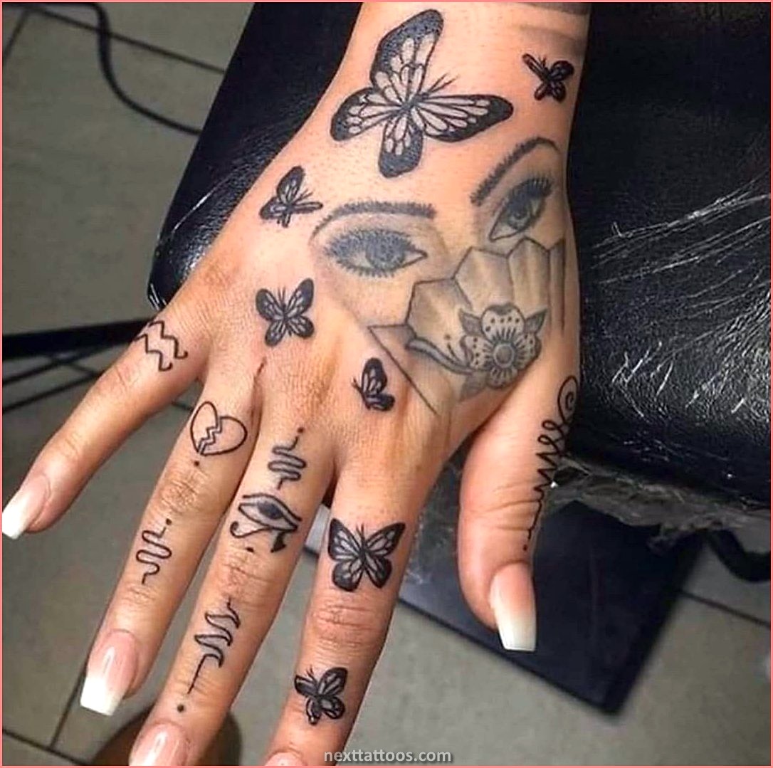 Female small hand tattoos