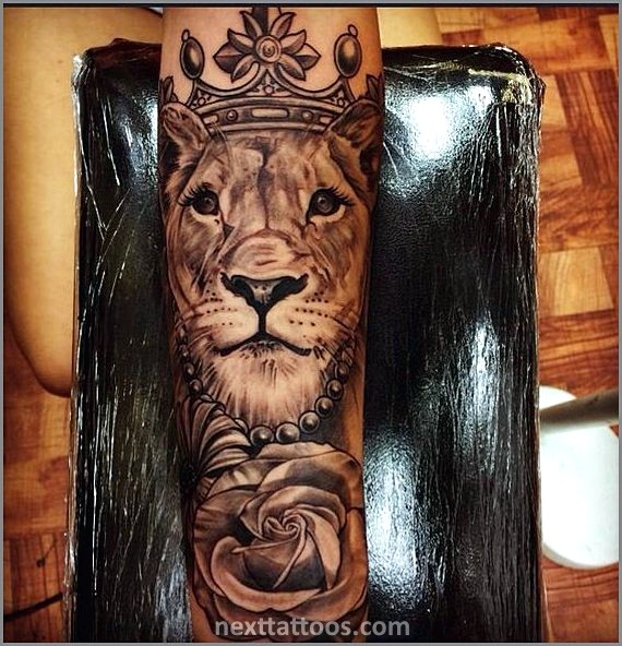 Female Lion Tattoo With Flowers